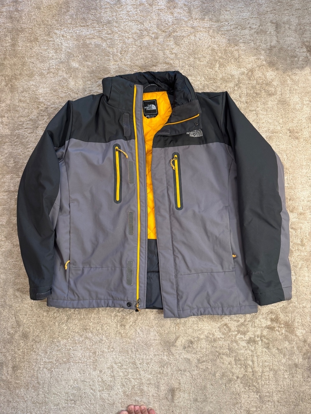 The North Face Men's Large Gray and Black Waterproof Jacket with Yellow Accents